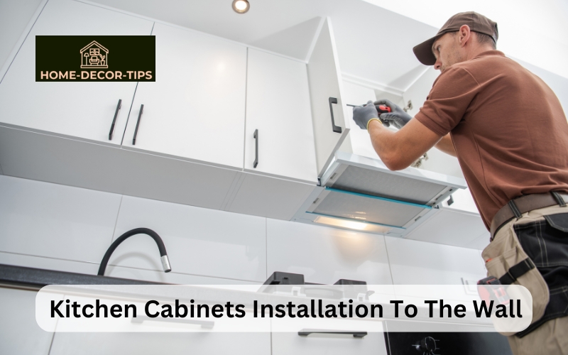 How are kitchen cabinets attached to the wall